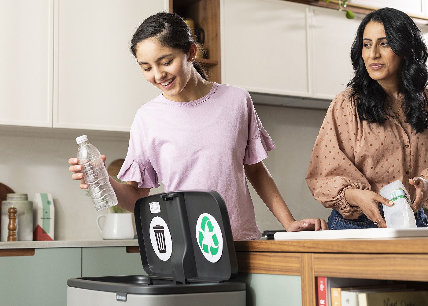 mum and daughter recycling