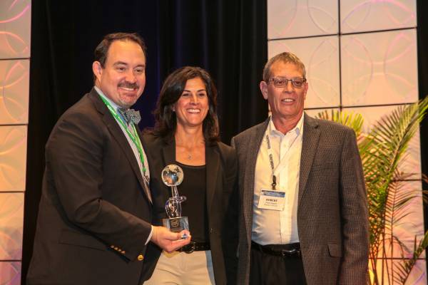 Demilec team accepting an award